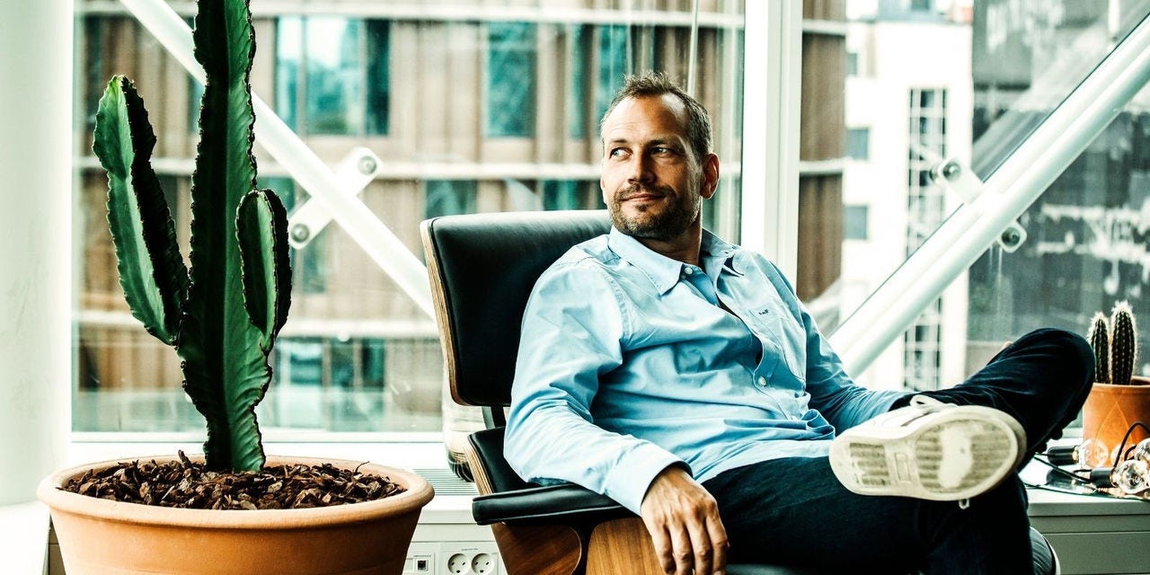 Visma Dinero posing in chair next to plant