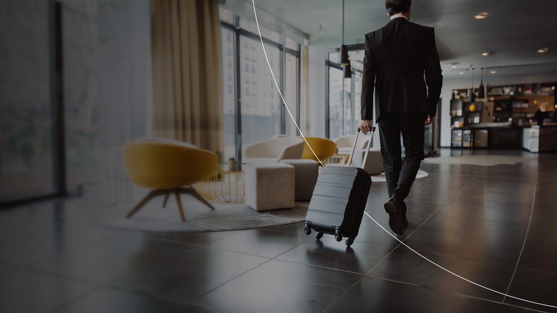 Businessman with luggage walking in airport desktop banner.