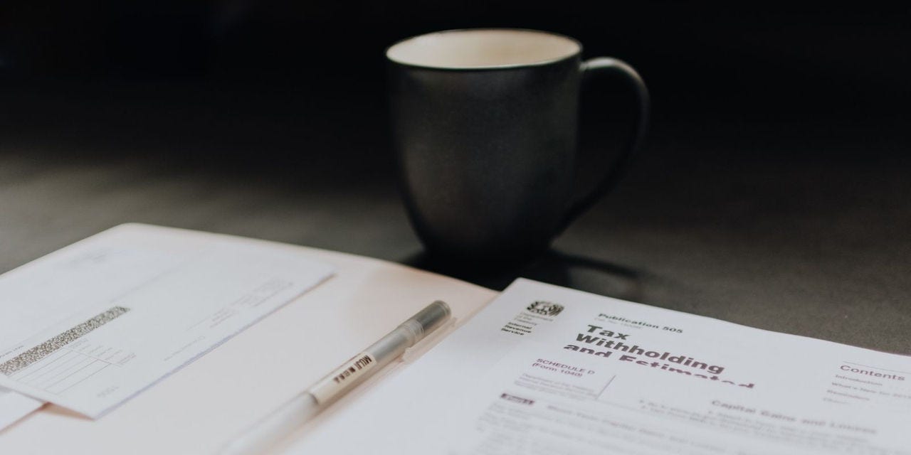 Cup of coffee and paper