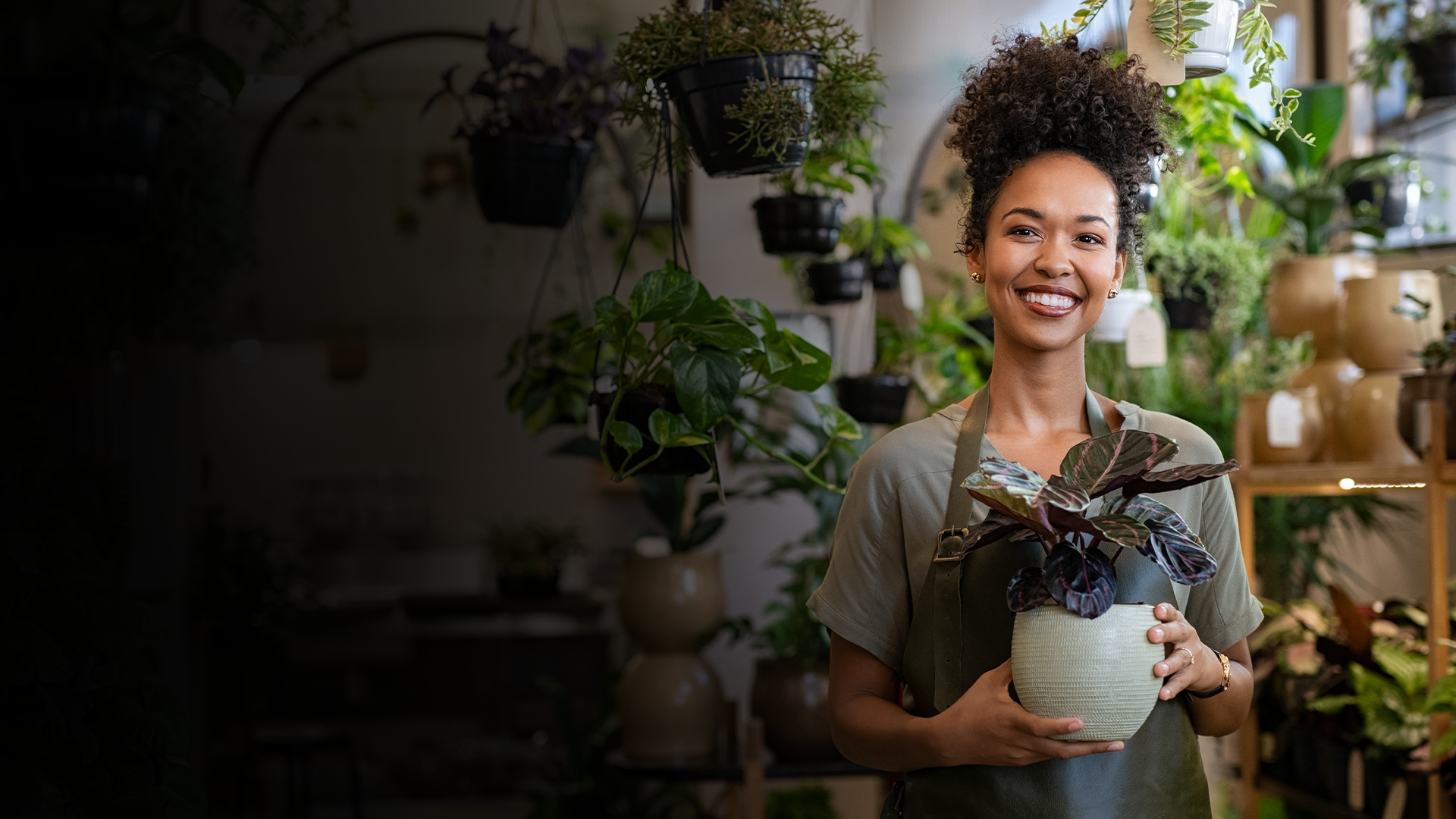 Woman holding a flower pot