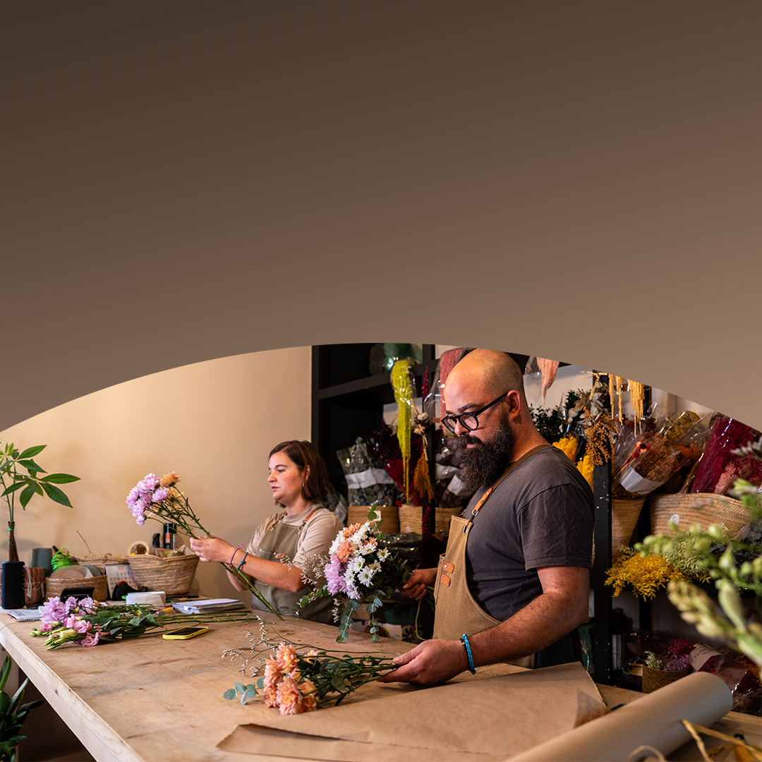 people working together in flower shop