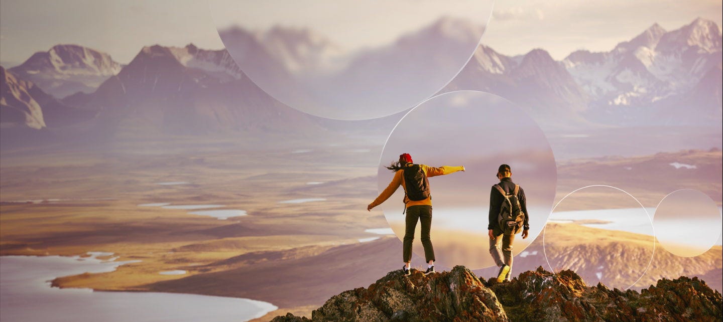 couple standing on top of a mountain