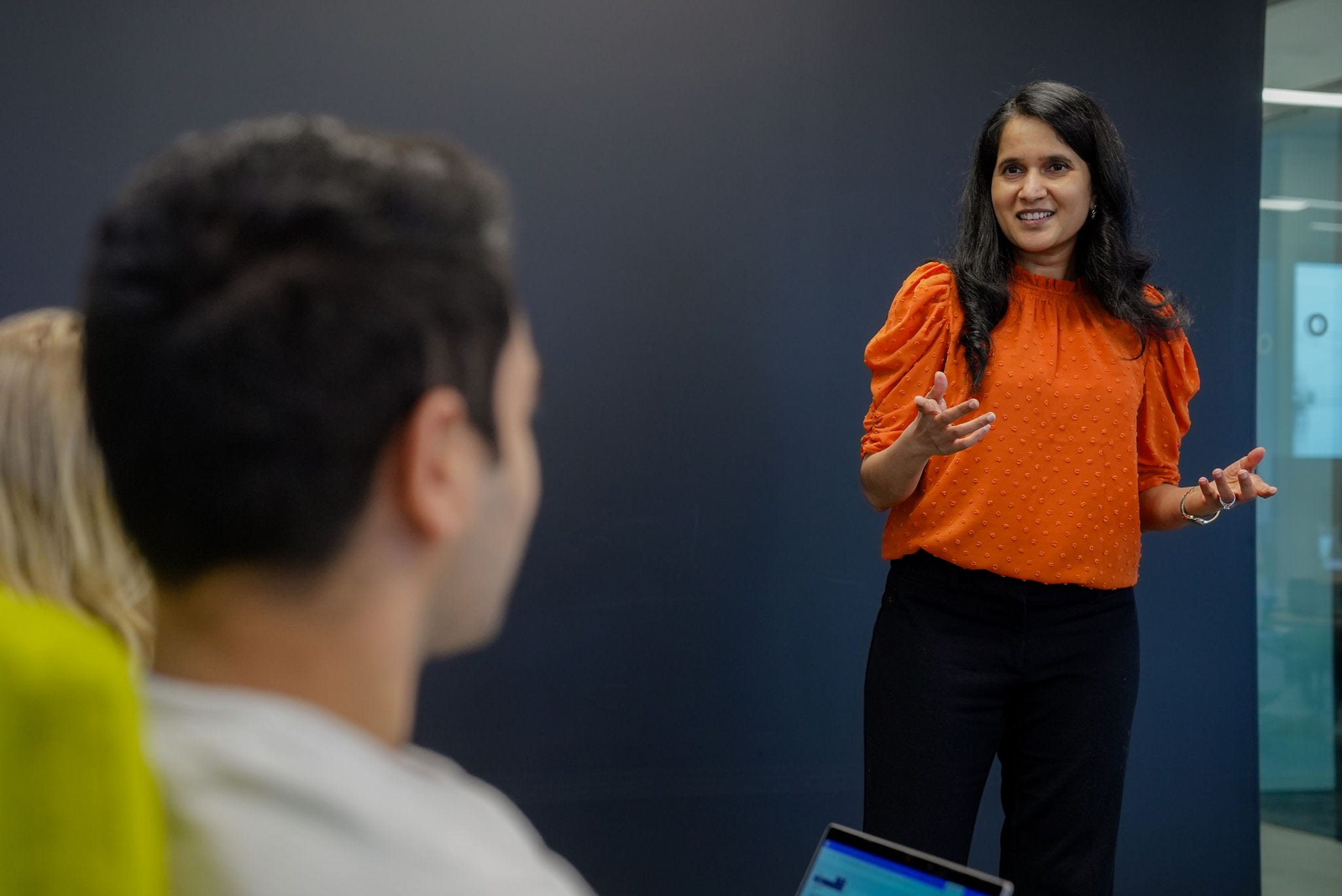 Woman presenting to group of people