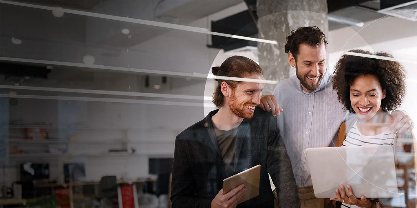 Happy empllyees working together