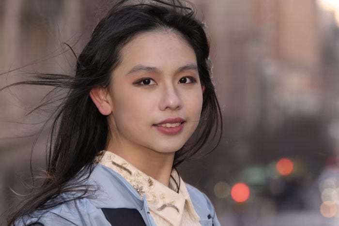 Asian woman looking into camera