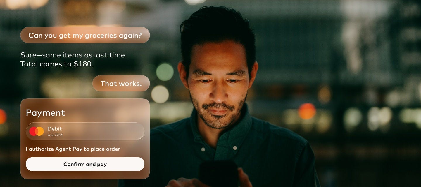 a man looks at his phone with a image of an agentic payment on the screen. 