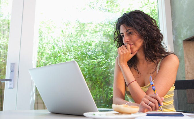 Woman checking her laptop