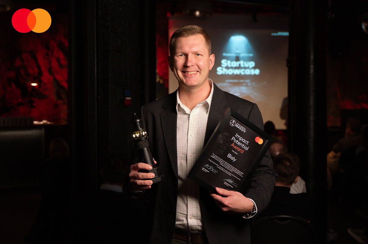 startup showcase winner with award certificate