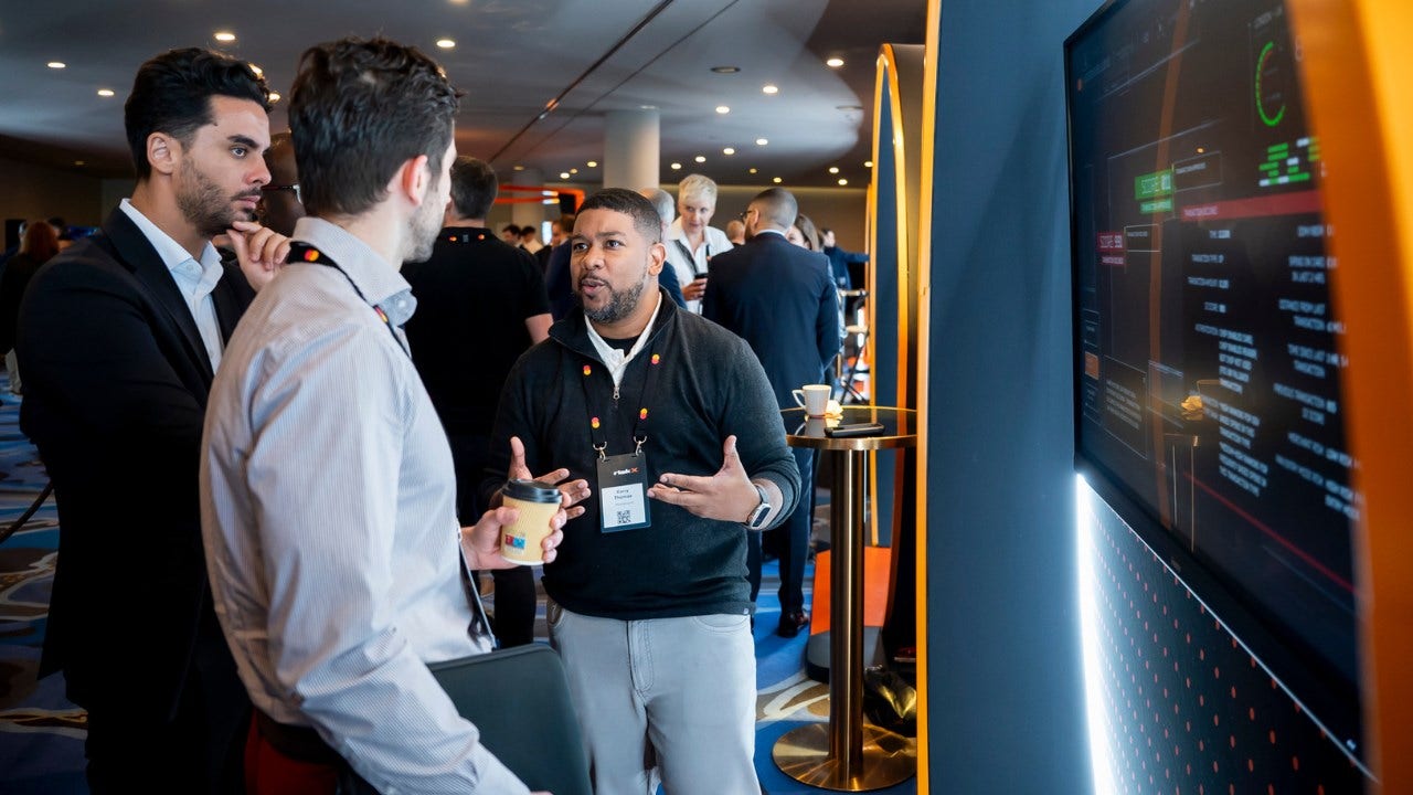 Kerry Thomas demonstrates a cyber solution at RiskX cybersecurity conference. 