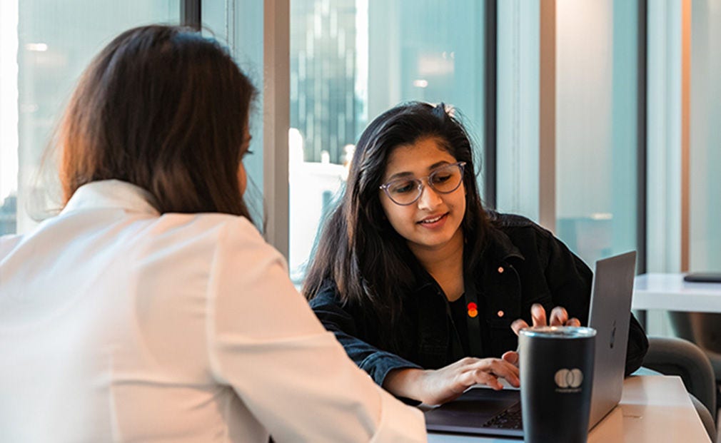 Mastercard emplyee discussing with customer