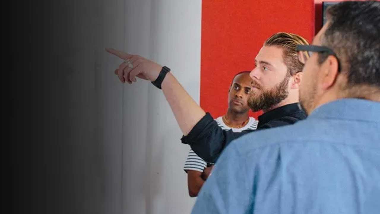 Man pointing at board