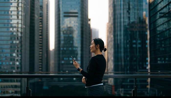 Woman on rooftop on phone