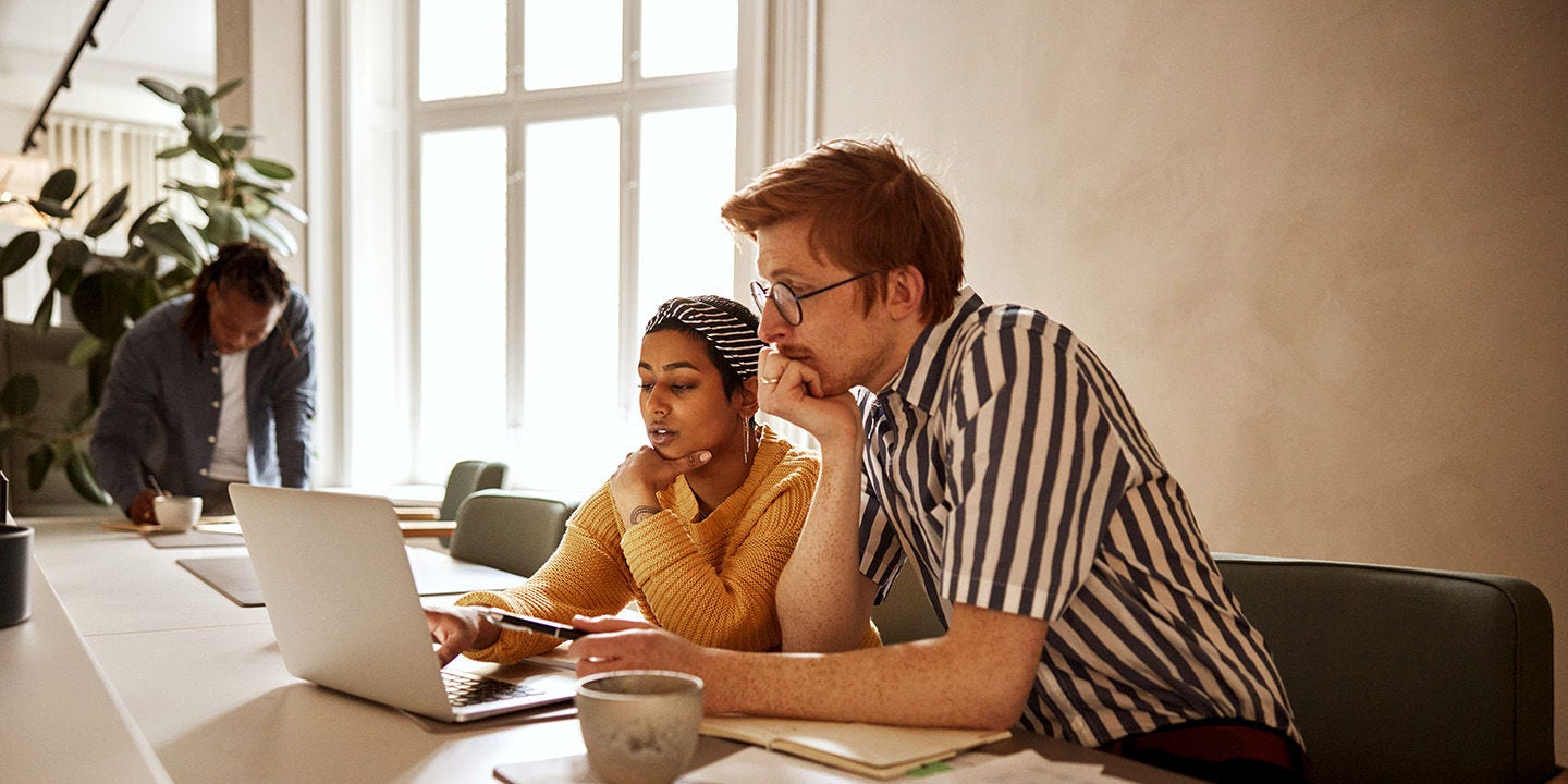 Man and woman using a laptop