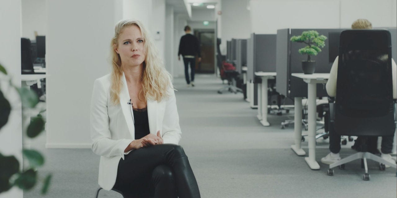 Woman being interviewed at the office