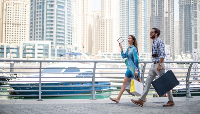 Couple walking on a pier