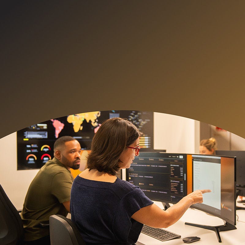 People at their desks with computers