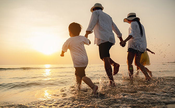 Happy family at sunset.