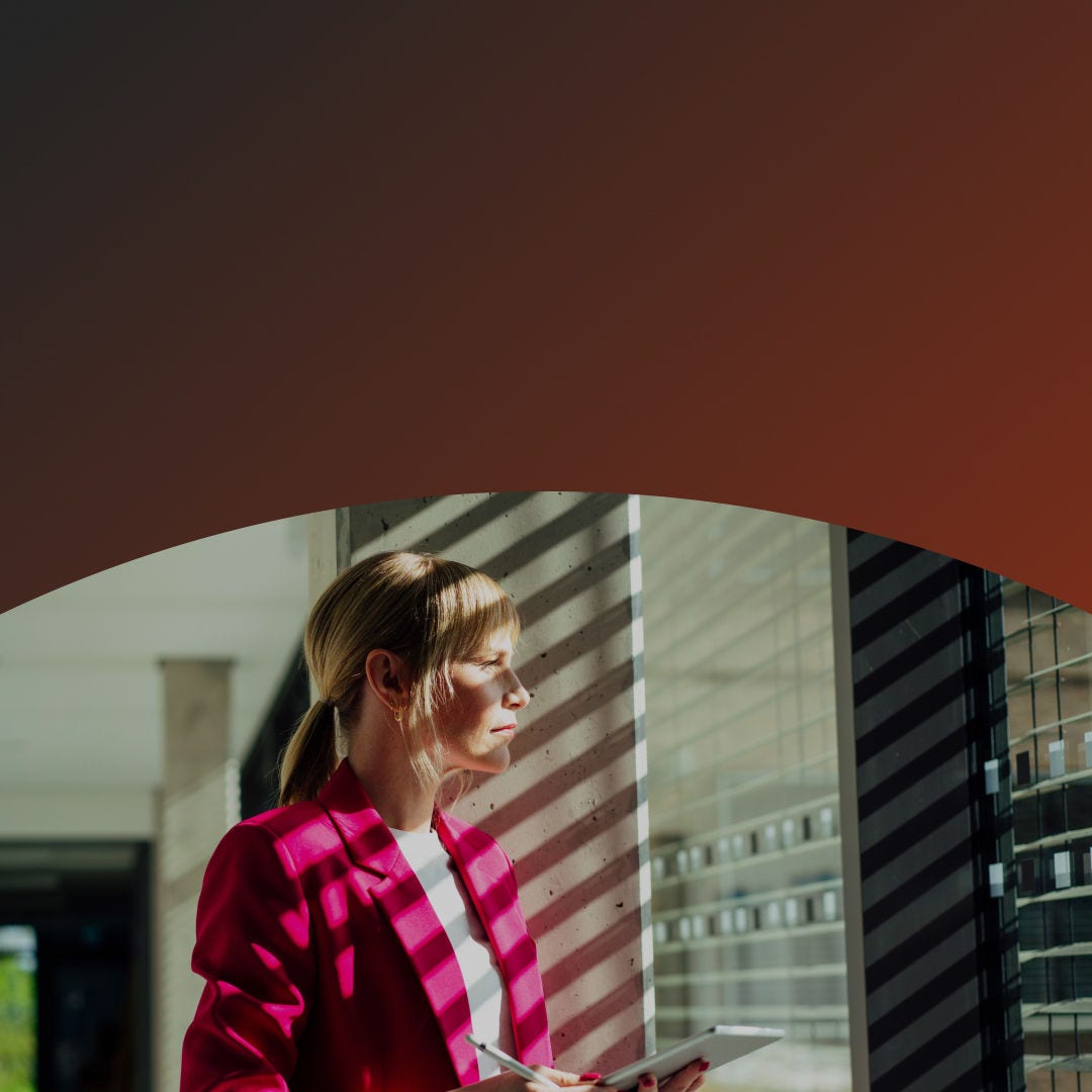 Woman in the office looking out the window