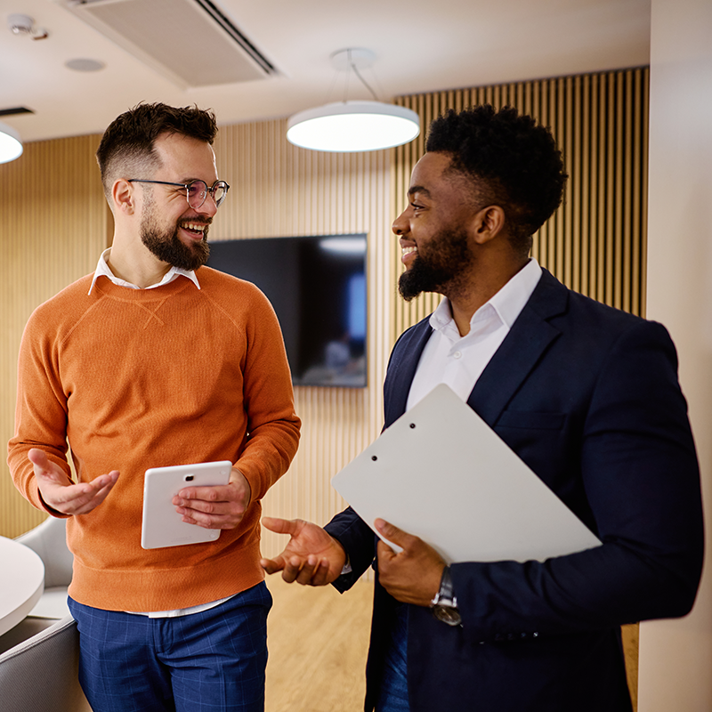 Man and woman discussing business while getting coffee