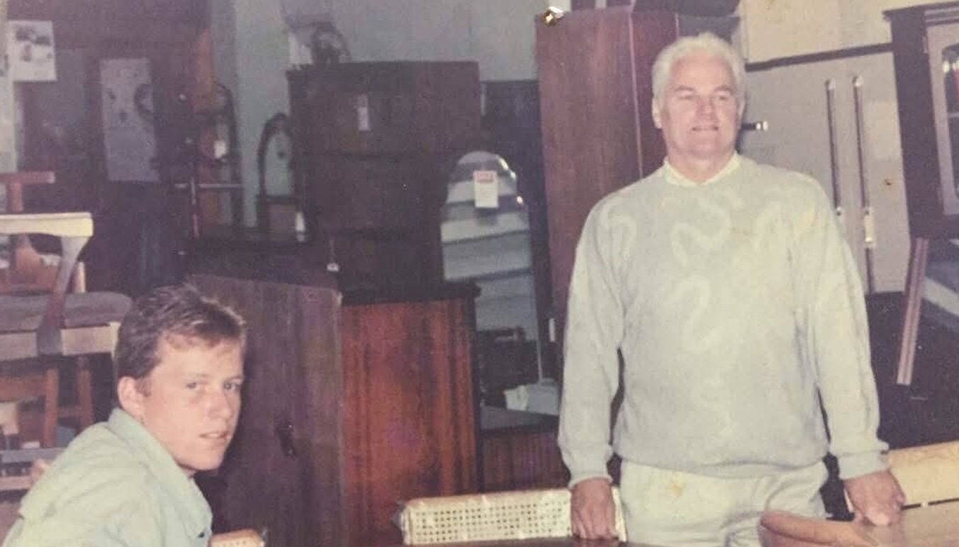 Marcus O'Toole and his father in their furniture store. 