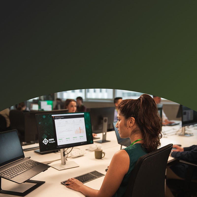 Woman at computer in an open concept office