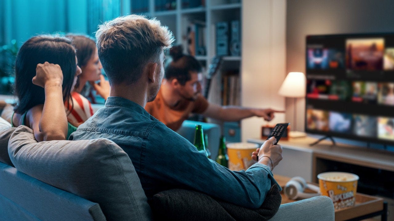 Group of people watching tv