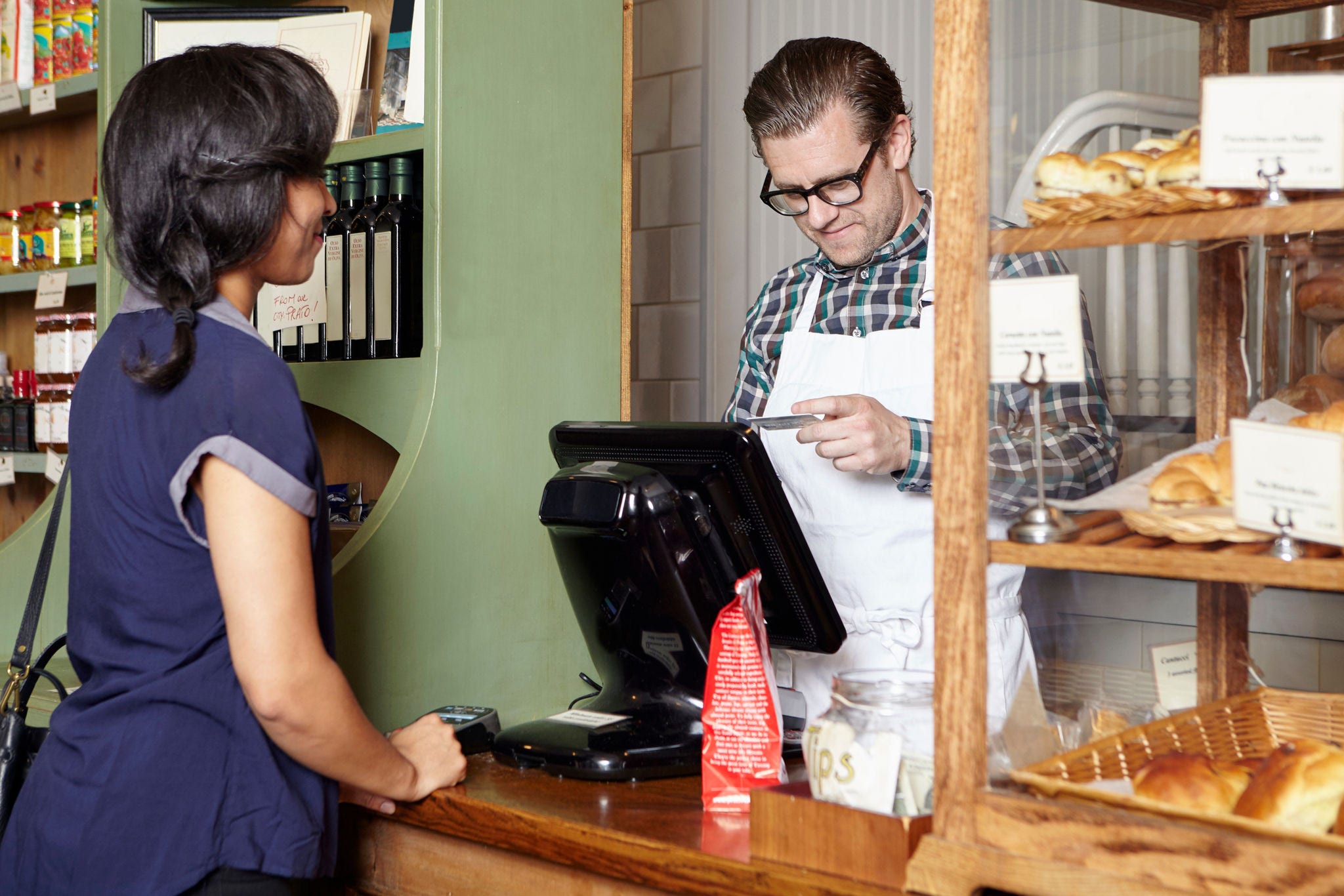 Business owner and customer completing a transaction