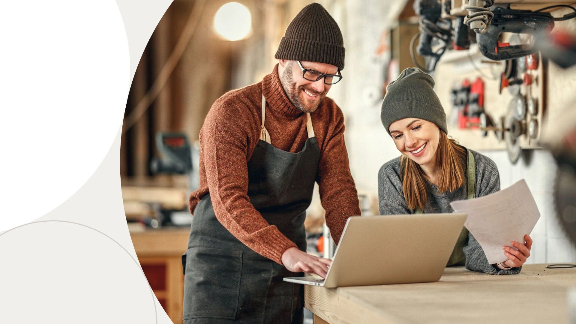 image of man and woman looking at laptop screen