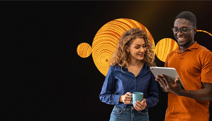 Two people looking over report data