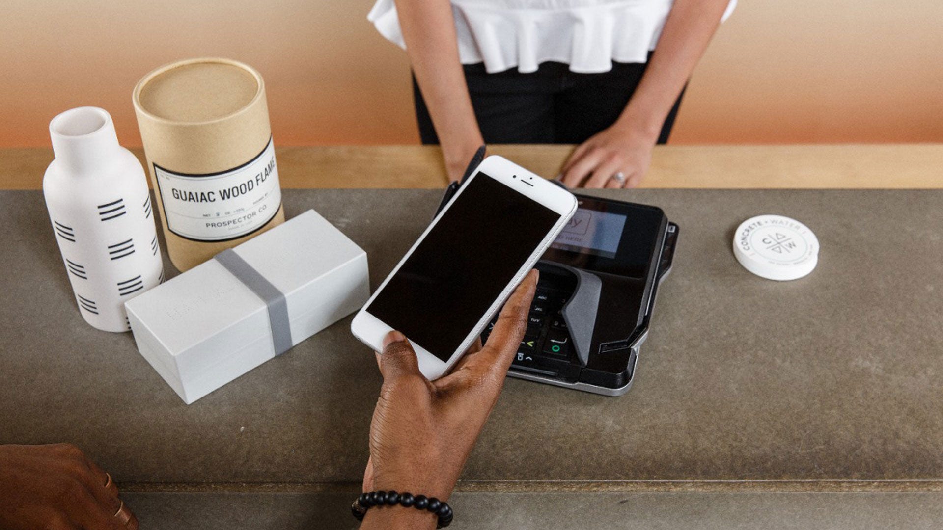 Person paying with phone