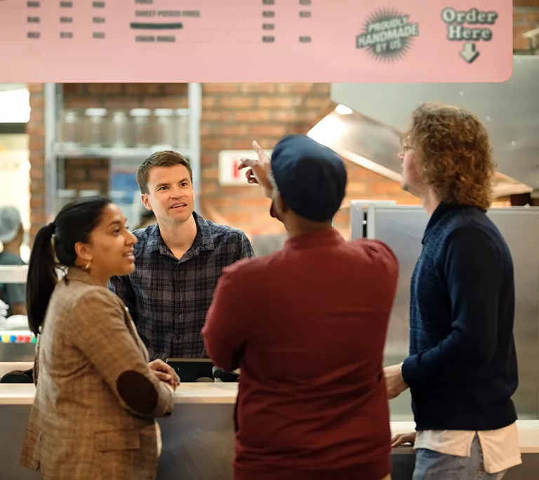Group of people ordering at a restaurant