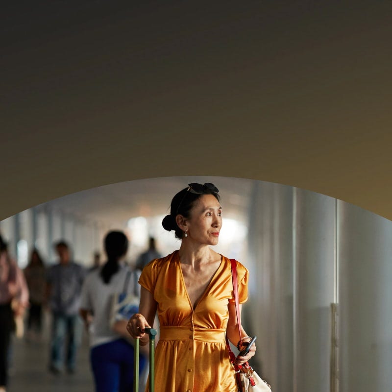 women with a suitcase in an airport