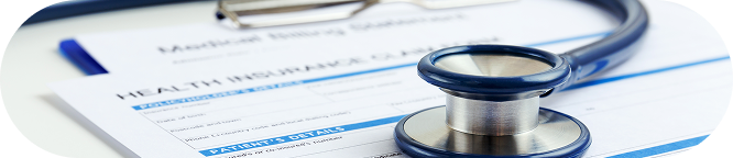 Stethoscope on health insurance form.