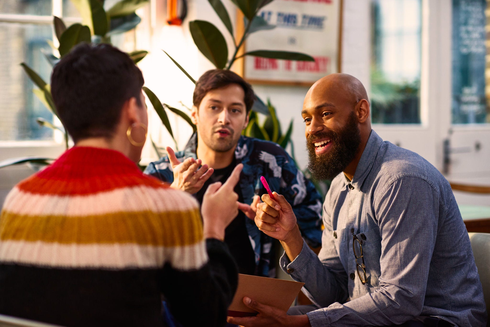 A Man discussing in group