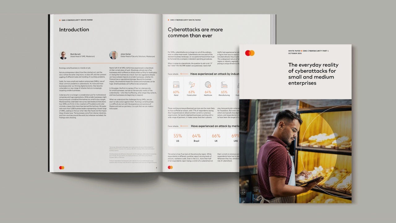 White paper cover and opened to a page. 