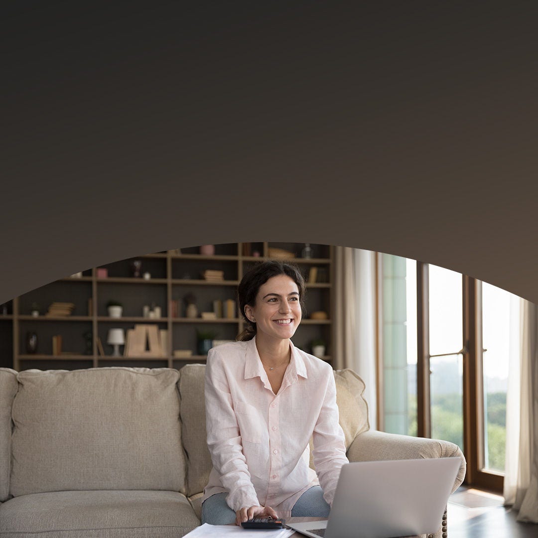 Young content homeowner using laptop.