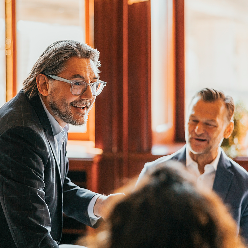 Man and woman discussing business while getting coffee