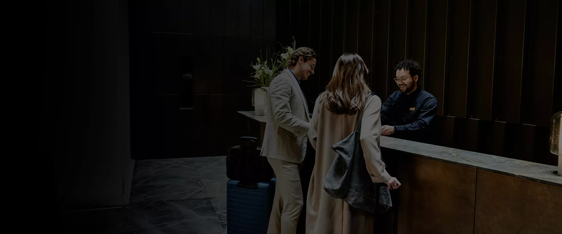 Couple at a hotels front desk